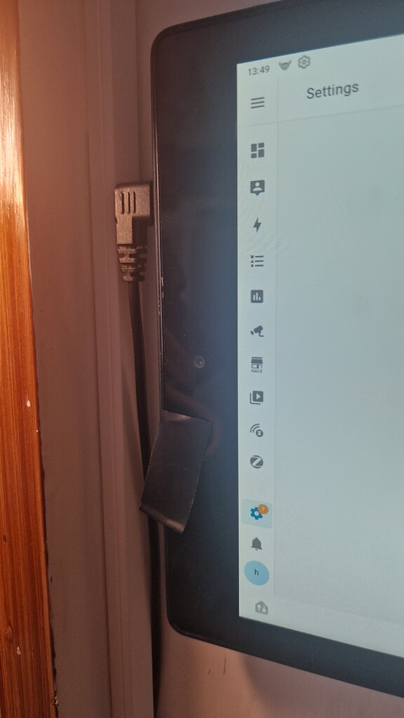 Remotely controlled camera cover for wall-mounted Amazon Fire HD tablet